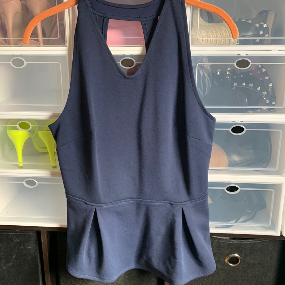 Beautiful cut out back top. Never worn.